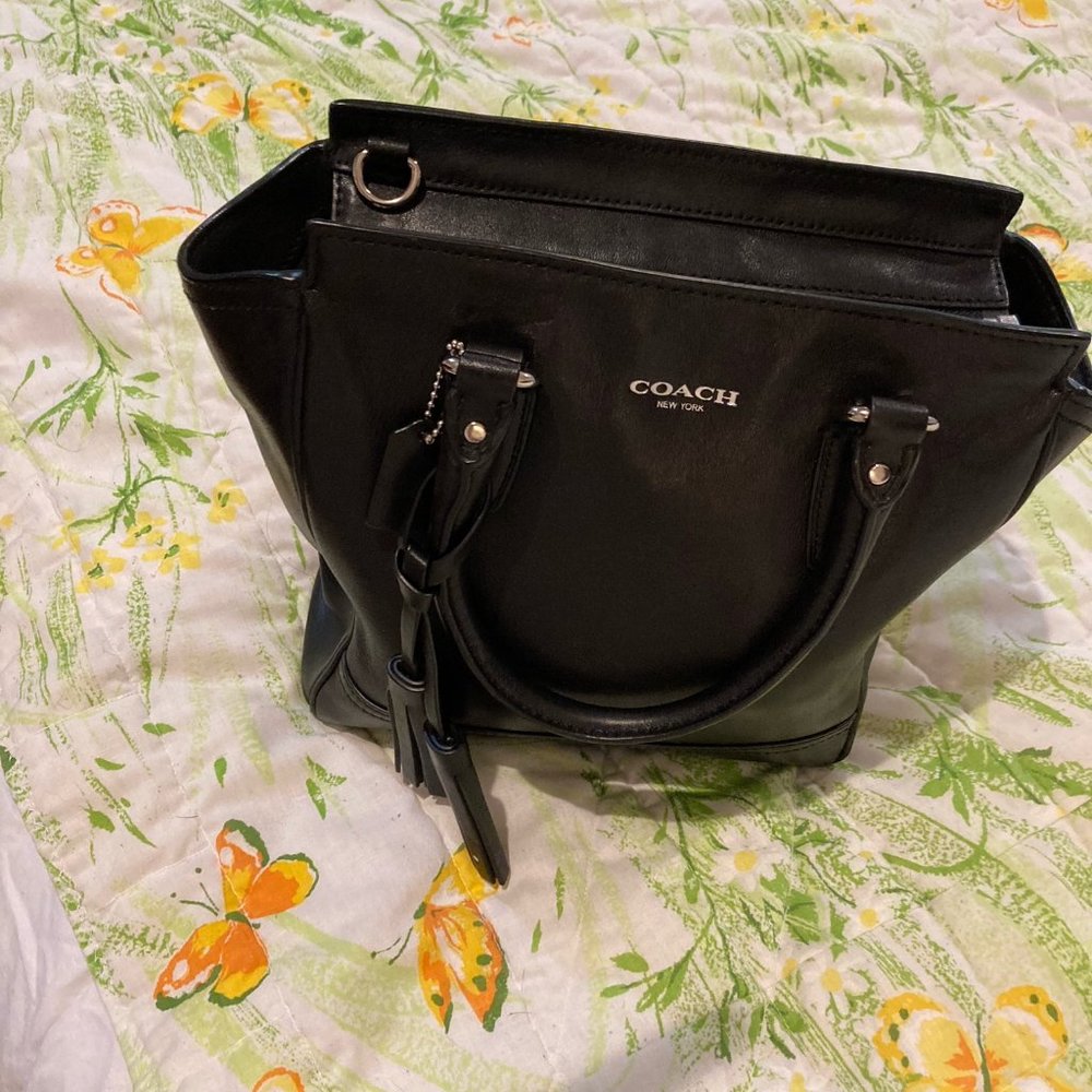 Coach black fun shaped purse with tassle